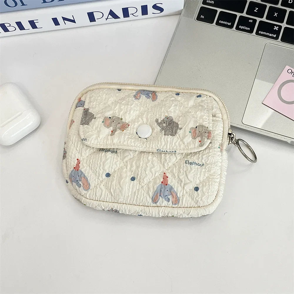 Blushimmer cute cartoon travel cosmetic bag with lipstick, earphone, card slots, and makeup organizer for women.