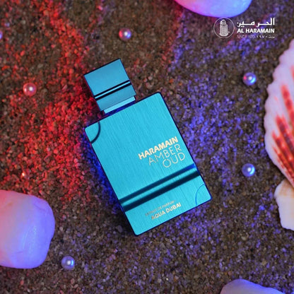 Al Haramain Amber Oud Aqua Dubai unisex Eau de Cologne bottle, 2 oz, featuring elegant packaging and a long-lasting fragrance.