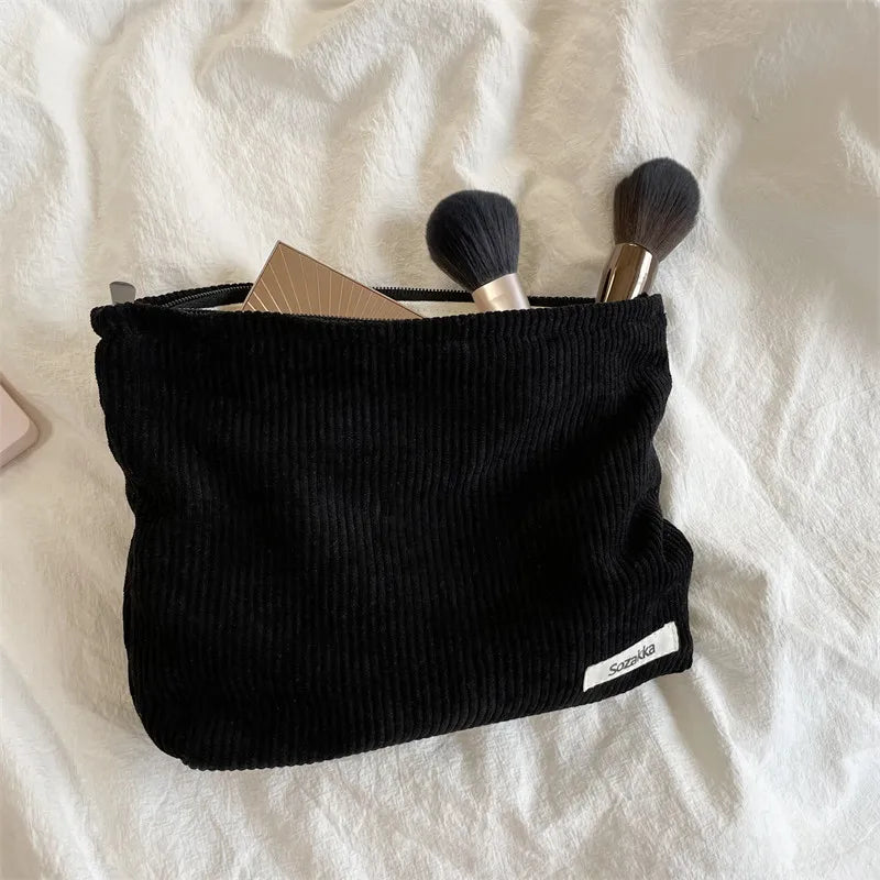 Blushimmer corduroy makeup bag for women, large capacity with lipstick, mobile phone, and change compartments, handheld style.