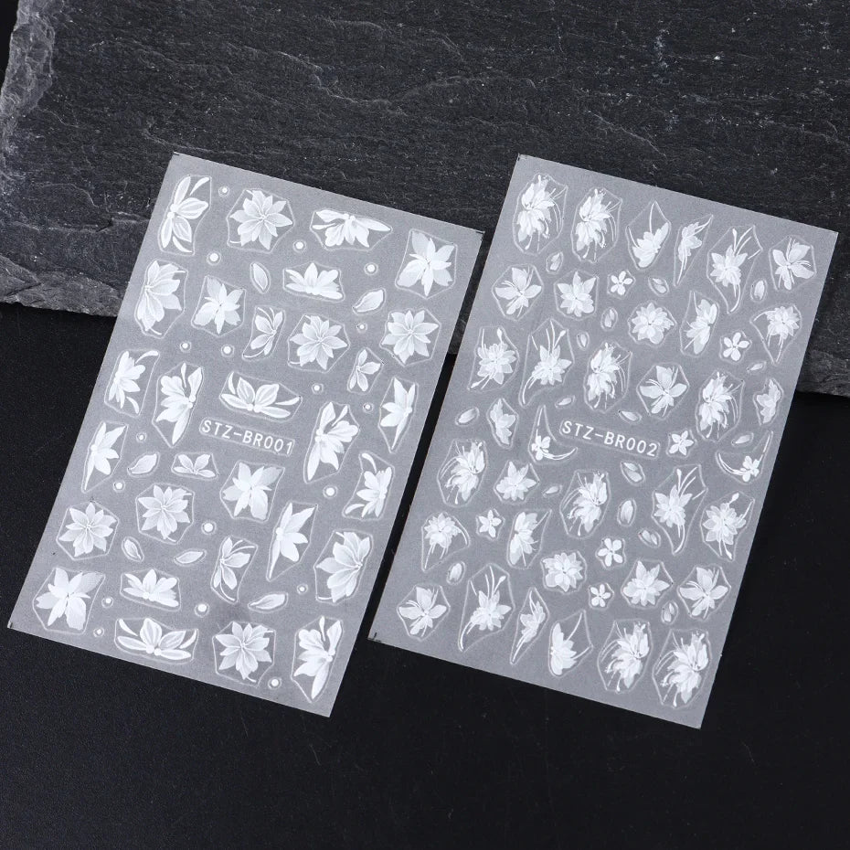 Blushimmer 3D white flower nail art stickers with cute floral designs, adhesive acrylic nail decals for DIY nail decoration.