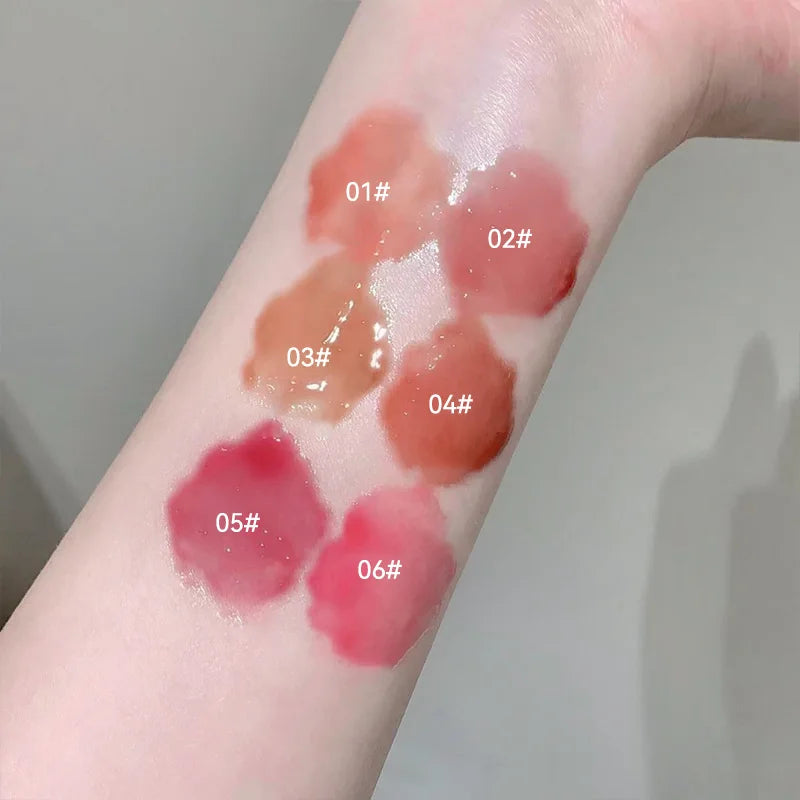 Blushimmer Kakashow Mirror Watery Lip Gloss displaying a glossy, moisturizing jelly lip tint in a clear container with a mirror finish.