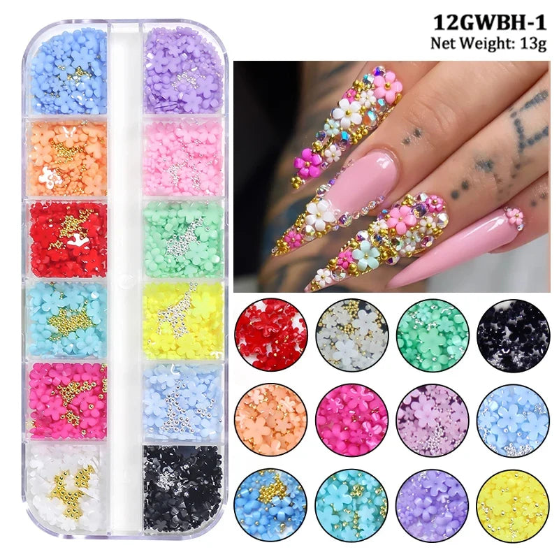 White acrylic flower nail art decorations with mixed size rhinestones and colorful gems for DIY manicure designs.