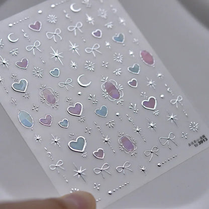 Colorful Cat's Eye 5D gradient European love heart gem nail art stickers with wing and geometric designs for manicures.