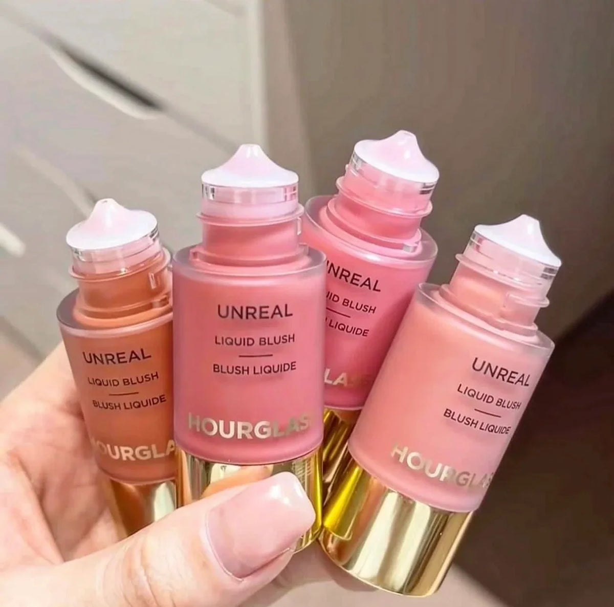 Blushimmer Lasting Natural Liquid Blush in 6 matte colors with hourglass packaging, featuring a multifunctional rouge stick.