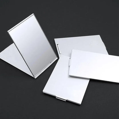 Blushimmer aluminum folding portable makeup mirror with compact, foldable design, ideal for on-the-go cosmetics and lash application.