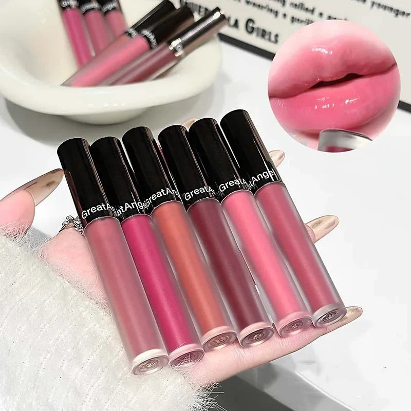 Berry red translucent lip gloss by Blushimmer with hydrating, water-light texture and a clear, jelly-like finish on the lips.