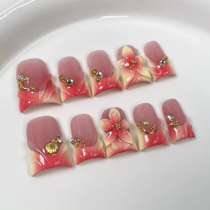 Set of 10 Blushimmer ocean style fake nails with 3D flowers, pearls, gradient blush, and French tips in duck bill press-on nail design.