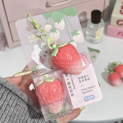 Shiji Strawberry temperature-changing lip balm by Blushimmer showing a sleek tube with a strawberry design, highlighting hydration and softness.