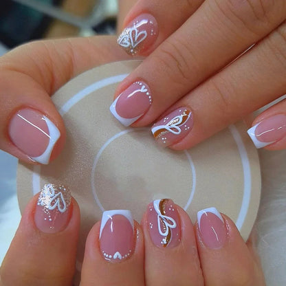 Set of 24 Blushimmer short square fake nails with halo dyed gradient hearts and colorful French tip design.