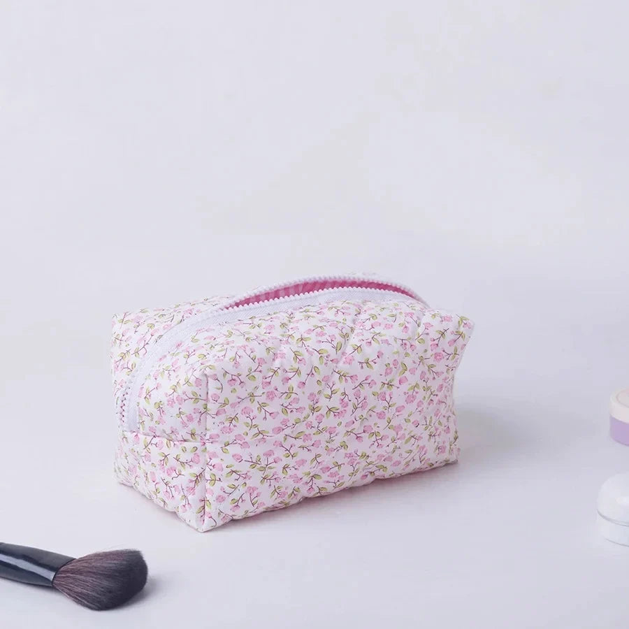 Blushimmer floral quilted makeup bag with puffy design, large travel cosmetic pouch, flower print, and multiple compartments.