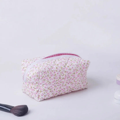Blushimmer floral quilted makeup bag with puffy design, large travel cosmetic pouch, flower print, and multiple compartments.
