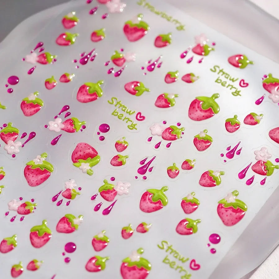Red cherry-shaped nail art stickers with shiny crystals and bowknot designs for DIY manicure decoration by Blushimmer.