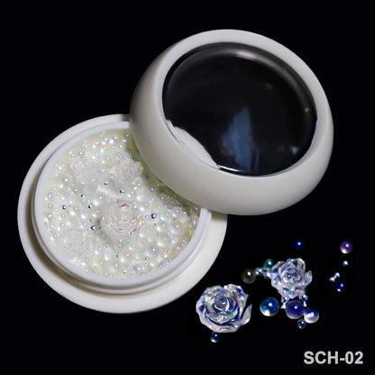 White acrylic flower nail art decorations with mixed size rhinestones and colorful gems for DIY manicure designs.