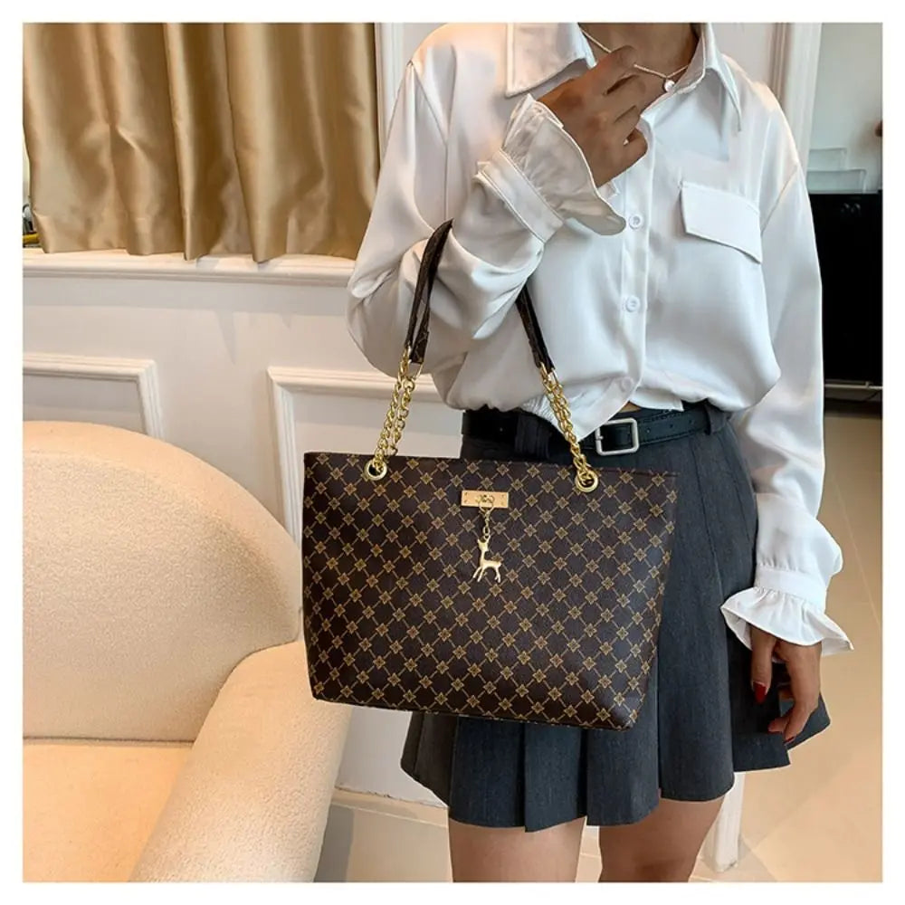 Women luxury tote bag with large capacity, printed shoulder handbag, stylish trendy design for shopping and everyday use.