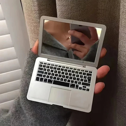Blushimmer portable mini computer-shaped foldable makeup mirror with high-quality reflective surface, compact pocket beauty accessory.