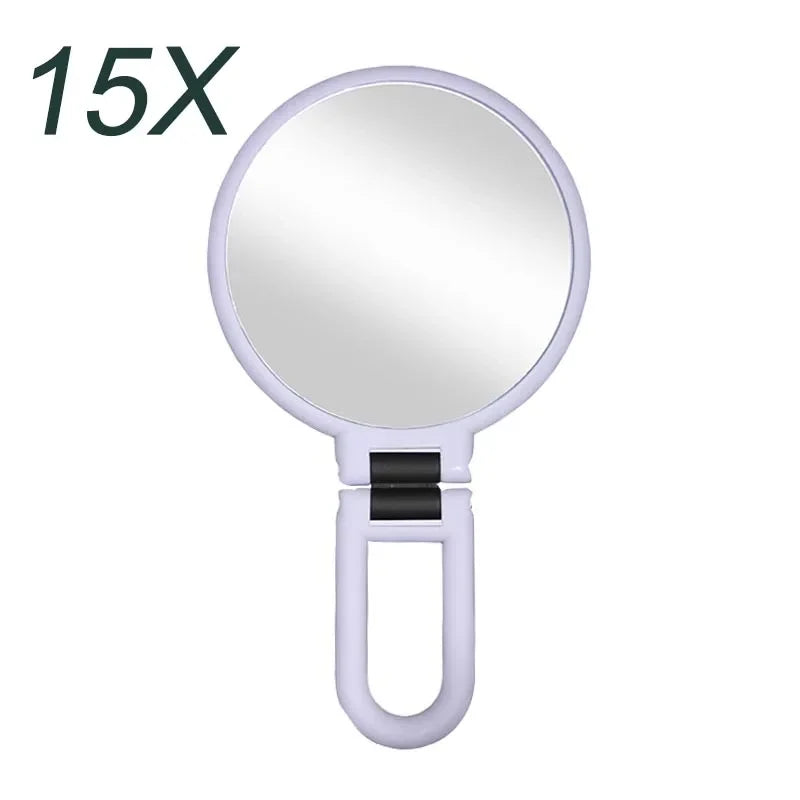 Blushimmer pocket magnifying makeup mirror with 2x to 15x zoom, small folding design, suitable for women’s table or travel use.