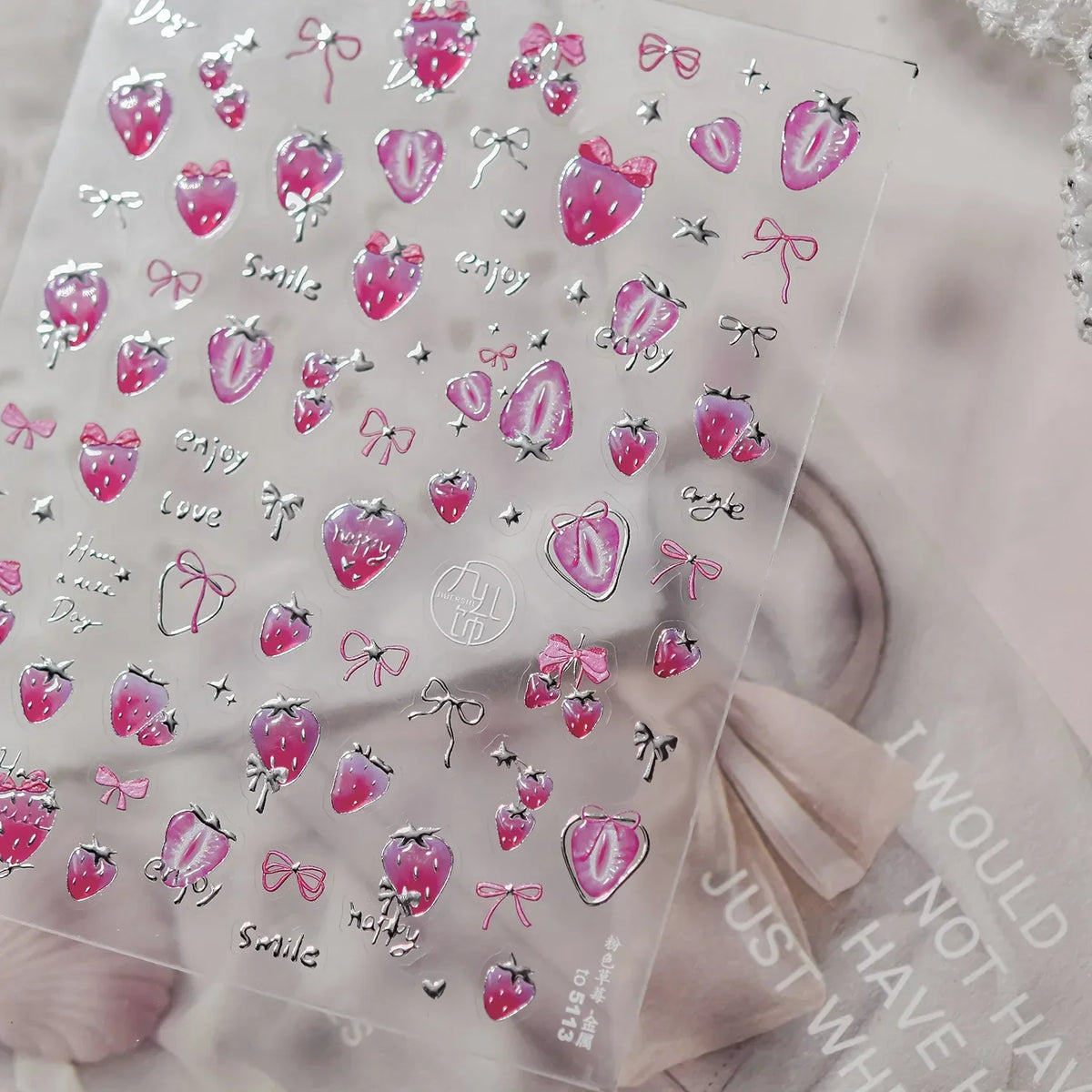 Close-up of Blushimmer cherry-shaped 5D nail art stickers with shiny rhinestones and bowknot designs for manicure decoration.