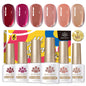 Six bottles of Blushimmer Born Pretty crystal amber gel nail polish set in pink and nude shades for winter manicures.