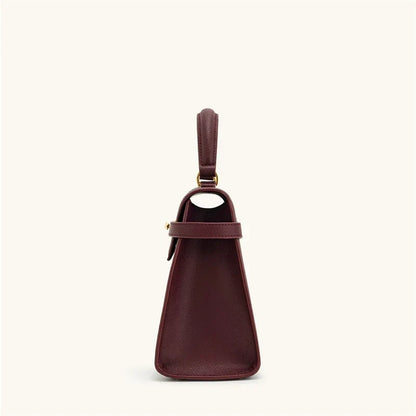 OBA women's wine red crossbody handbag with a structured satchel design, featuring a top handle and adjustable shoulder strap.