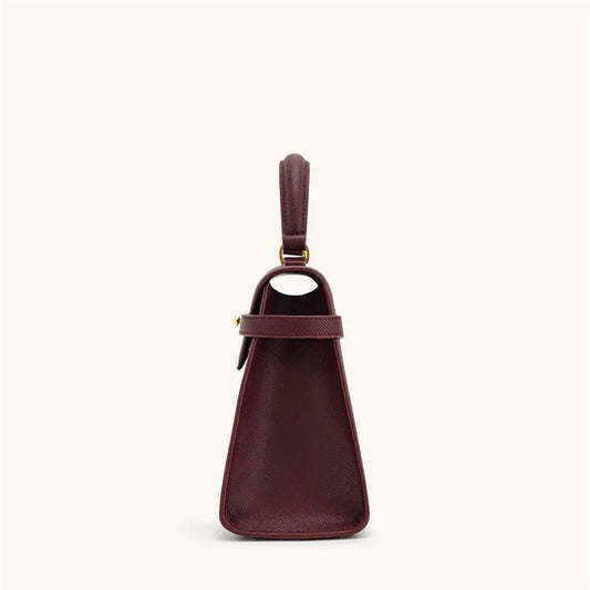 OBA women's wine red crossbody handbag with a structured satchel design, featuring a top handle and adjustable shoulder strap.