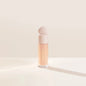 Blushimmer Rare Beauty liquid contour and highlighter in a sleek bottle, featuring a shimmering face blush and luminous glow.