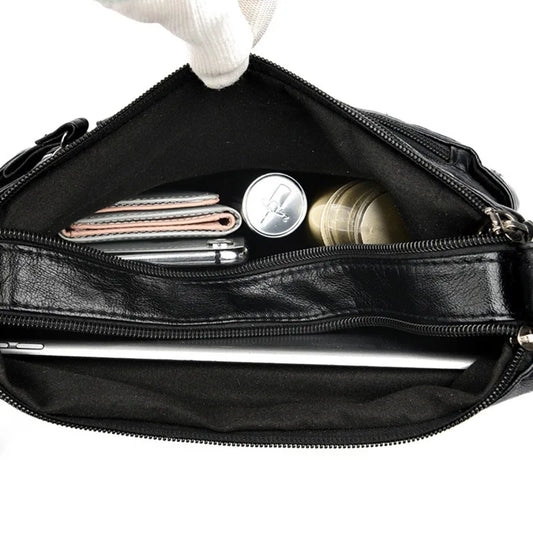Women's black multi-layer leather shoulder crossbody bag by OBA with multiple compartments and sleek design.