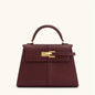 Wine red women's crossbody handbag by OBA, stylish satchel bag with adjustable strap and elegant design.