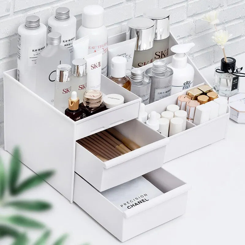 White Blushimmer plastic makeup storage drawer box with compartments on a dressing table for cosmetics and skincare organization.