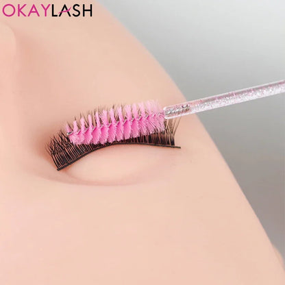 Set of 100 disposable eyelash extension brushes and spoolies by Blushimmer, micro mascara wands and combs for makeup application.