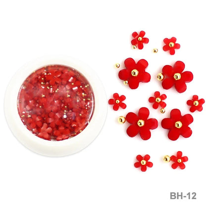 White acrylic flower nail art decorations with mixed size rhinestones and colorful gems for manicure design by Blushimmer