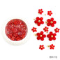 White acrylic flower nail art decorations with mixed size rhinestones and colorful gems for manicure design by Blushimmer