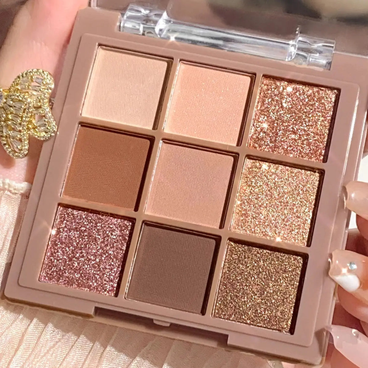 Blushimmer luxury eyeshadow palette with 9-18 berry, brown, and nude shades in matte and shimmer finishes, waterproof formula.
