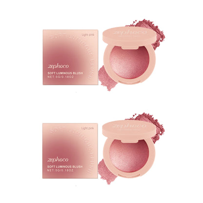 Blushimmer Pearl Blush with soft light pink powder for a natural, radiant finish and long-lasting, buildable color on the cheeks.
