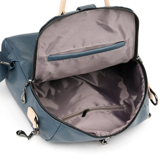 Blue women’s PU leather fashion backpack with adjustable straps and multiple compartments, designed by LPO.