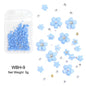 White acrylic flower nail art decorations with mixed size rhinestones and red-blue gems for DIY manicure design.