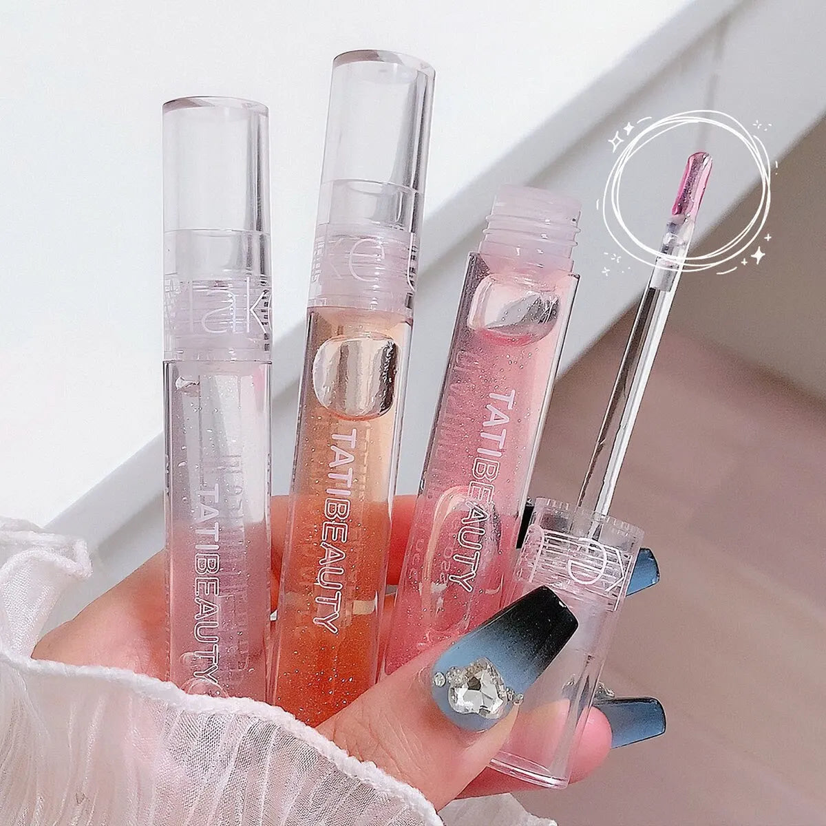 Blushimmer Lip Oil Uuny Transparent Water Gloss with honey flavor, moisturizing lip glaze in a clear glass tube.