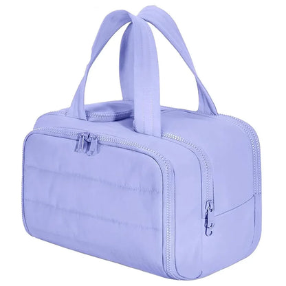 Large waterproof cosmetic bag by Blushimmer, travel toiletries organizer with multiple compartments for shower and makeup essentials.
