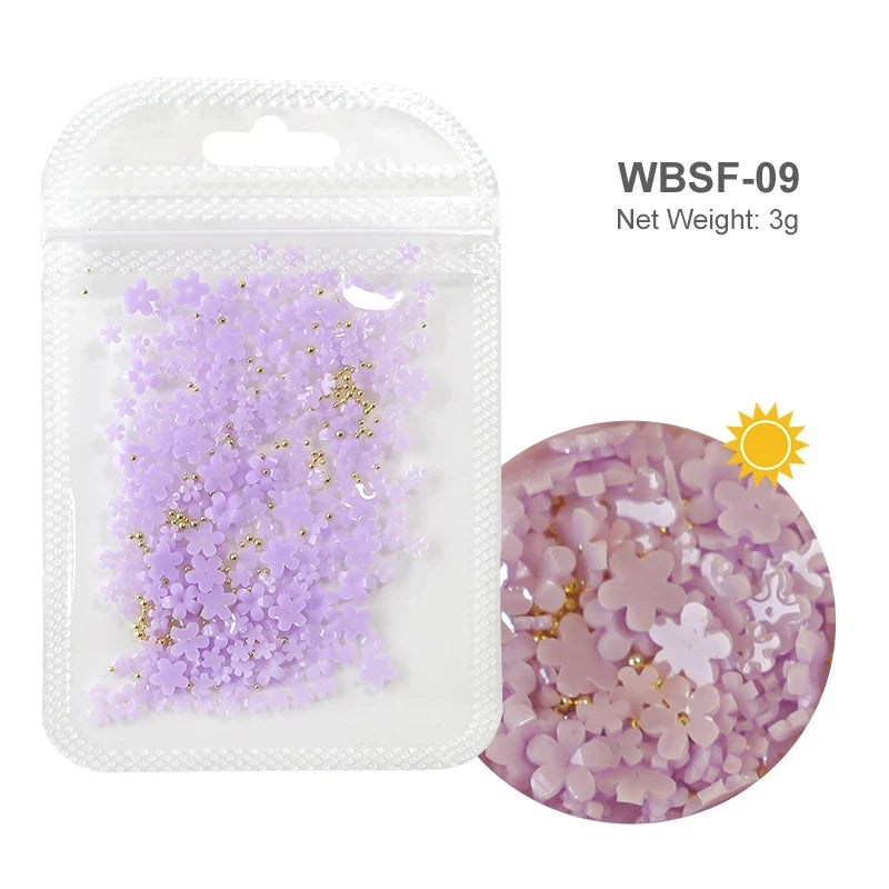 White acrylic flower nail art decorations with mixed size red and blue rhinestones for manicure DIY nail design accessories.