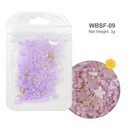 White acrylic flower nail art decorations with mixed size red and blue rhinestones for manicure DIY nail design accessories.