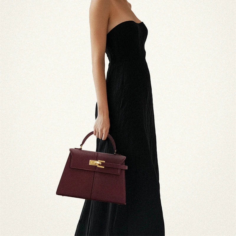 Wine red OBA women's crossbody handbag with sleek satchel design, featuring adjustable strap and stylish leather finish.