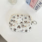 Blushimmer cute cartoon small travel cosmetic bag with lipstick, earphone, and card storage, ideal for makeup and accessories.