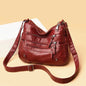 Red women's multi-layer leather shoulder crossbody bag by OBA, featuring multiple tiers and a sleek design.