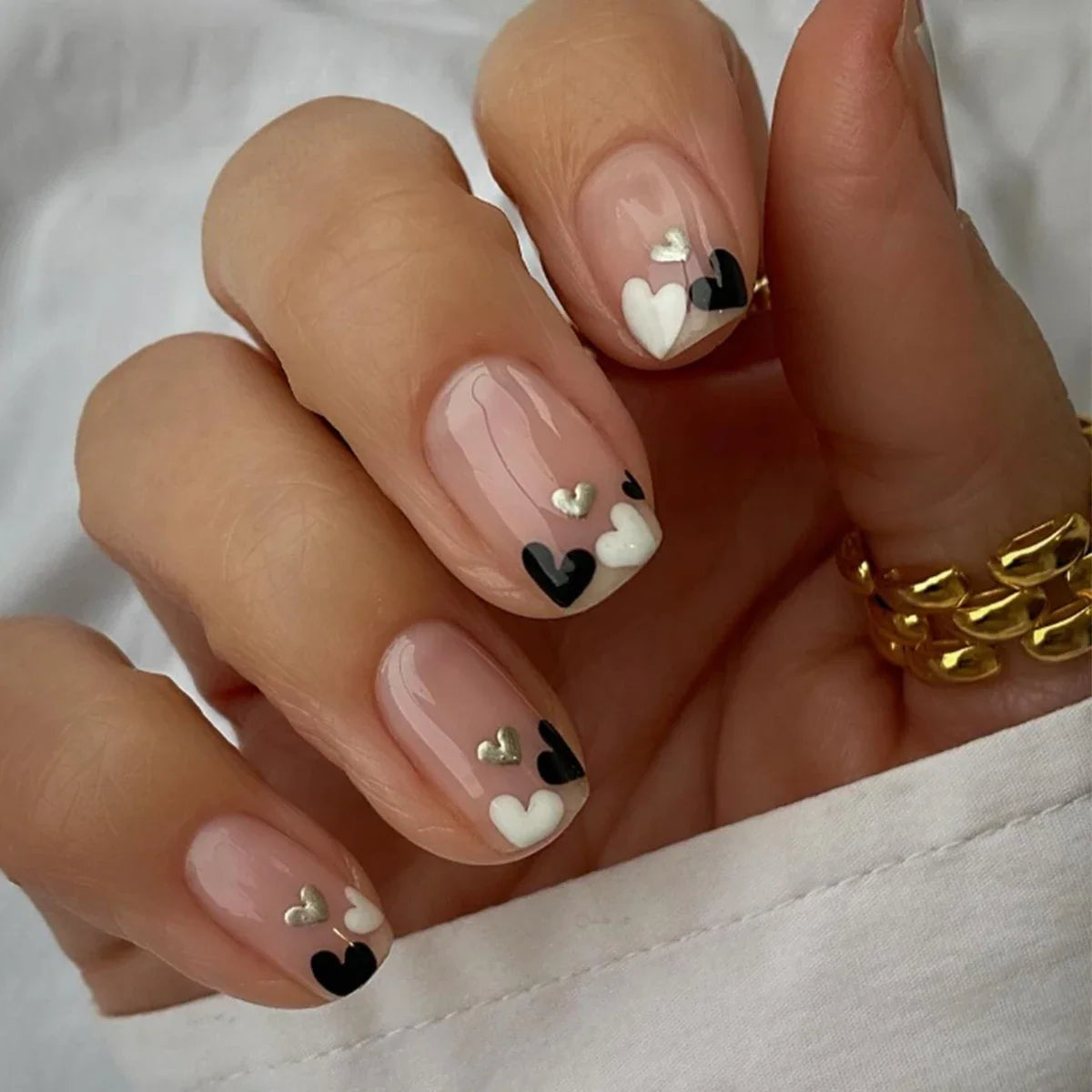 Set of 24 Blushimmer short square fake nails with halo dyed gradient heart and colorful French design on a white background