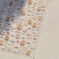 Brown kawaii bear nail art sticker from Blushimmer featuring self-adhesive Japanese cartoon animal decals for DIY nail decoration.