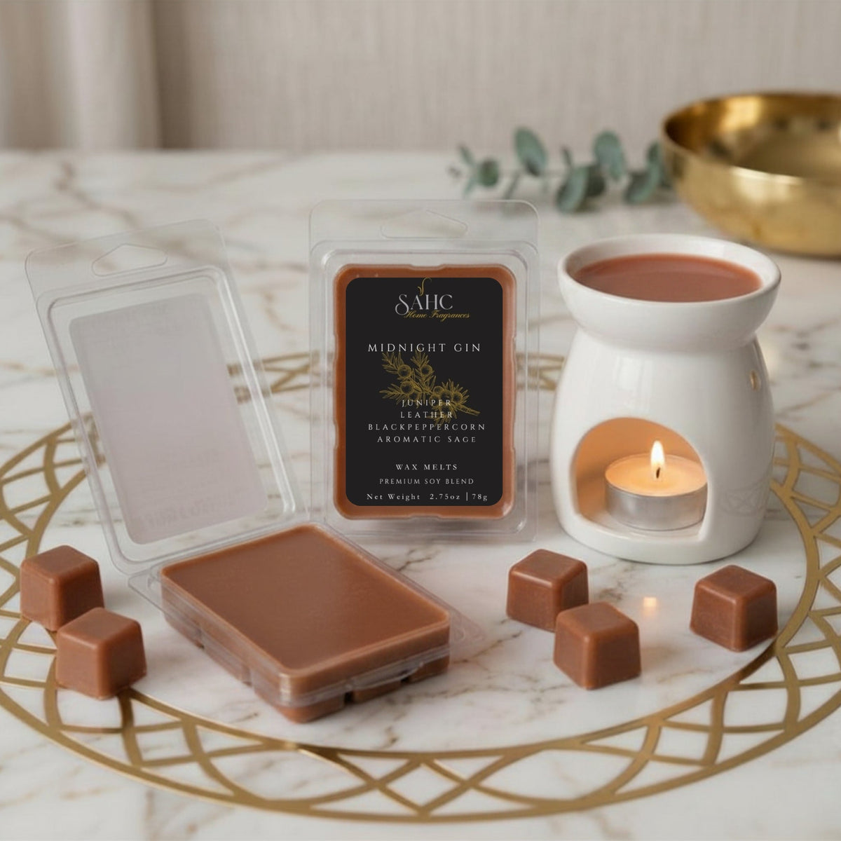 SAHC Home Fragrances Midnight Gin wax melts displayed in a cozy setting, showcasing elegant packaging and warm ambiance.