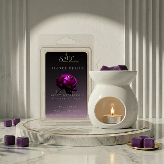 SAHC Secret Desire wax melts with a soft, inviting appearance in warm-toned packaging, showcasing the product's elegant design.