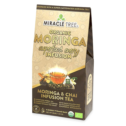 Organic Moringa Energy Tea by Miracle Tree, chai-flavored natural coffee alternative with vibrant tea leaves and brewing glass.