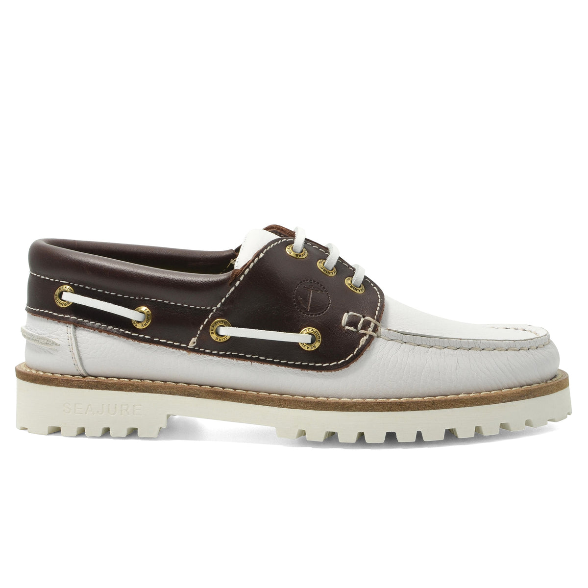 Seajure Women’s Izola boat shoes in navy with white laces, featuring a low-profile design and casual slip-on style.