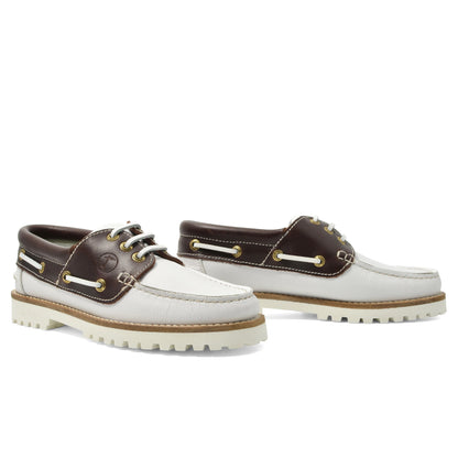 Seajure Women’s Izola boat shoes in tan leather with white soles and laces, displayed on a neutral background.