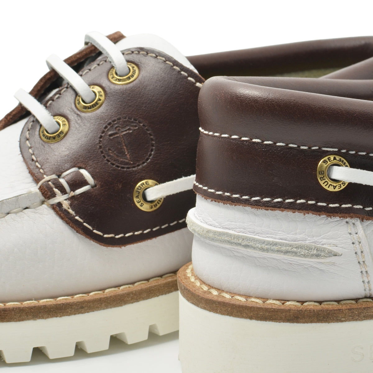 Seajure women's Izola boat shoe featuring tan leather with white laces and a classic nautical design.